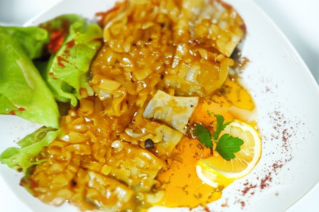 Śledzie z koncentratem pomidorowym i cebulą